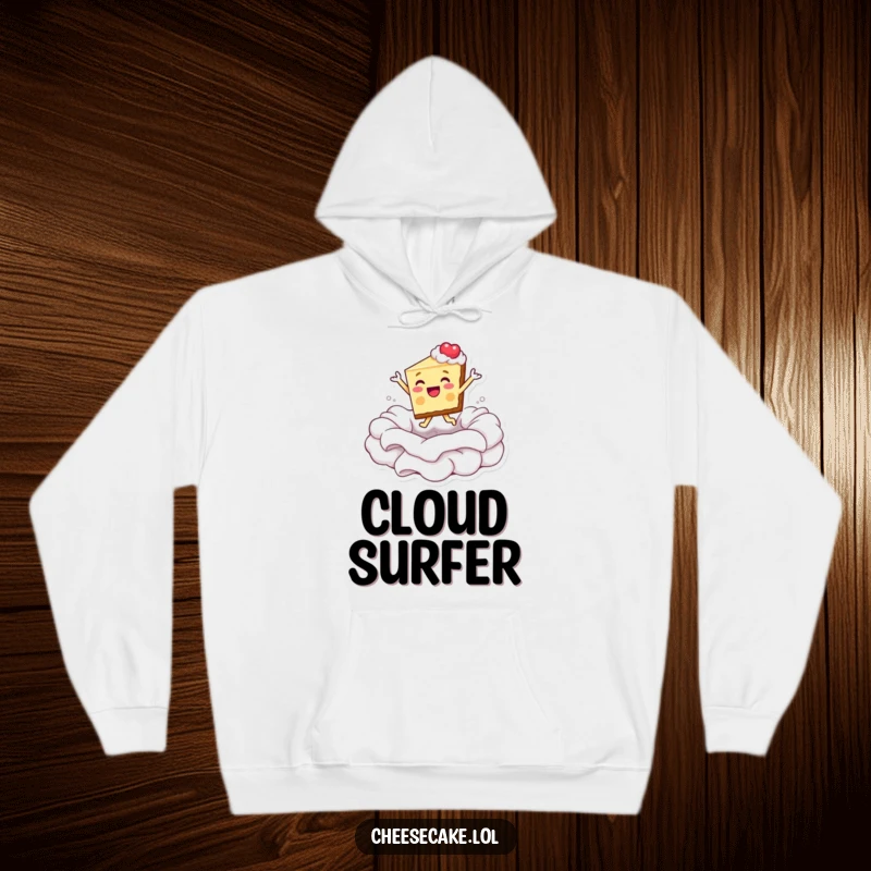 Funny hoodie depicting a happy cheesecake slice gleefully leaping into a generous pool of whipped cream.