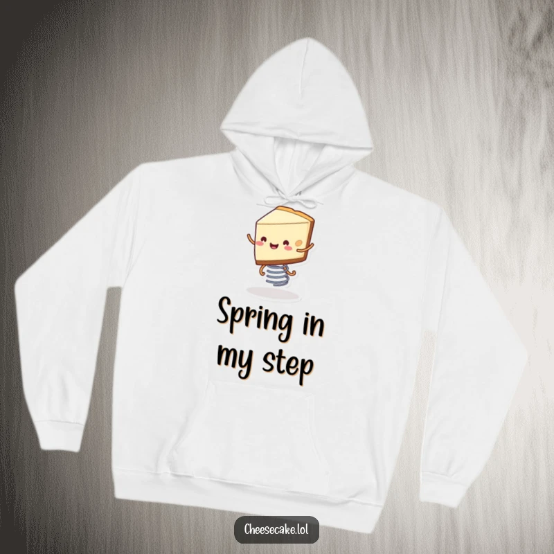 Funny hoodie featuring a smiling slice of cheesecake with its little legs bouncing on a spring, representing pure dessert happiness.