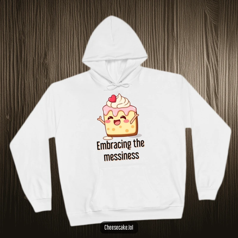 Funny hoodie featuring a delighted cheesecake slice, frosting melting, striking a silly pose, perfect for cozy fun.