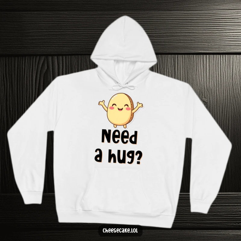 Funny macaron hoodie featuring a smiling, anthropomorphic macaron with arms wide open, offering a warm, humorous, and comforting hug.