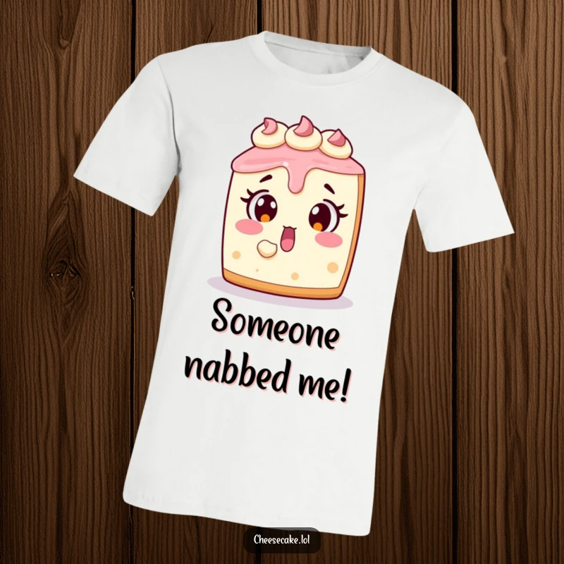 Funny cheesecake t-shirt showing a shocked dessert character with a missing slice, perfect for casual wear and foodies.