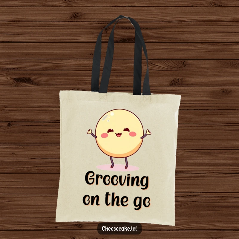 Funny tote bag showcasing a wobbly cheesecake round with stick legs doing a silly dance jig, perfect for dessert dancers.